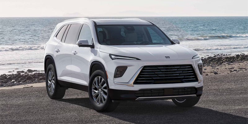 White SUV parked by the ocean