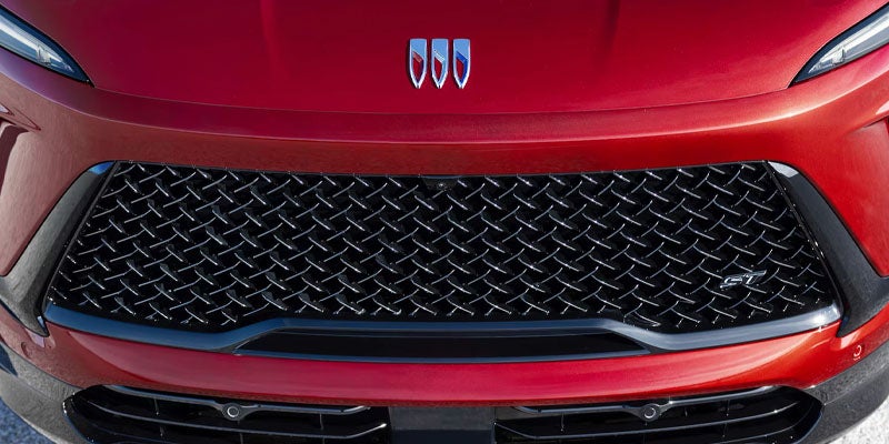 Close-up of a red SUV front grille