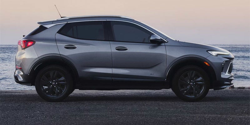 2026 Buick Encore GX Grey SUV parked beside the ocean
